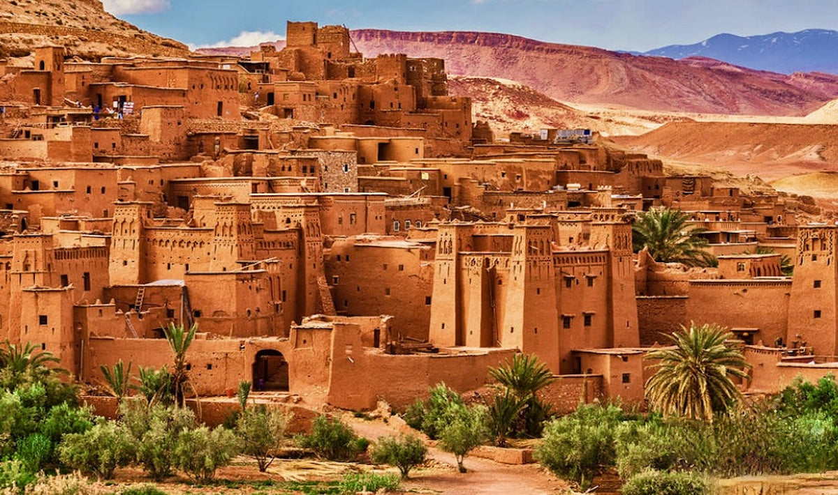 The earthen kasbah of Ait Benhaddou in warm morning light, southern Morocco.