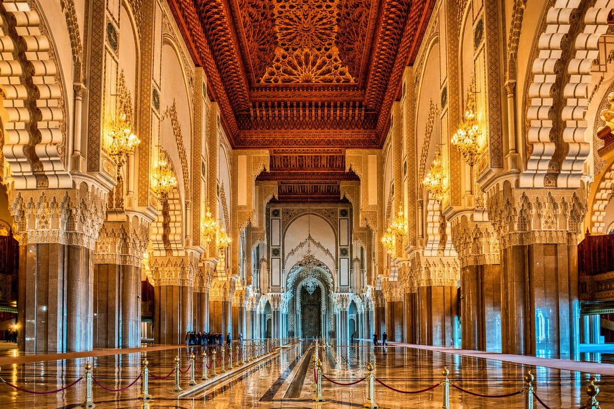 Prayer hall of the Hassan II Mosque with carved columns and chandeliers, Casablanca